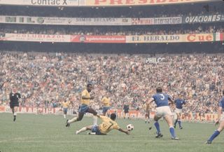 General view of Brazil and Pele in action against Italy in the 1970 World Cup final at Mexico's Estadio Azteca.