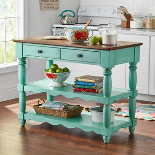 Teal kitchen island, with two shelves and drawers