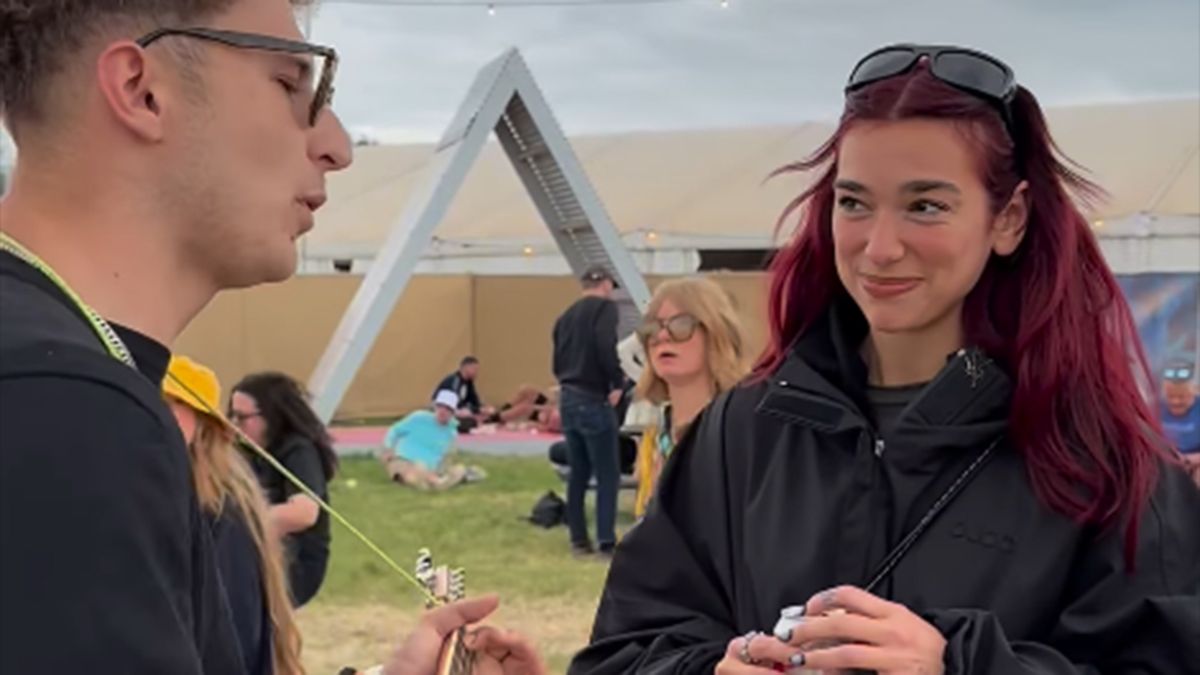 “I love it mate, so good,” says Dua Lipa, but her nonverbal reaction to the busker who insisted on playing his song to her at Glastonbury seems to tell a different story