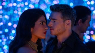 Mason Kane (Richard Madden) and Nadia Sinh (Priyanka Chopra Jonas) with their faces close to each other as they look at one another.