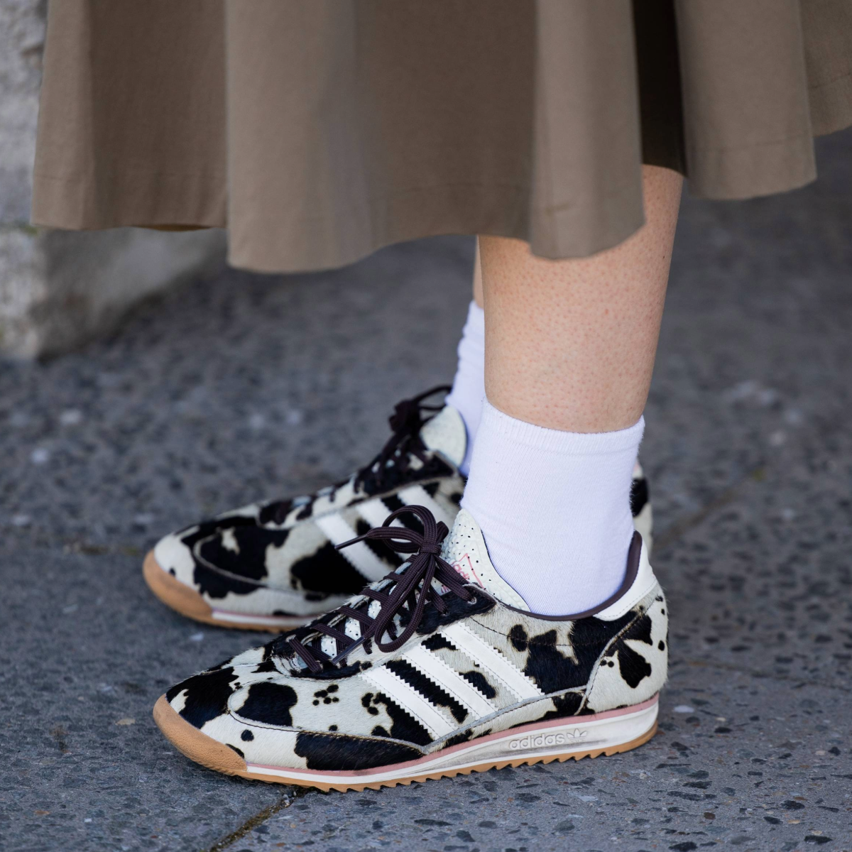 BERLIN, GERMANY - JULY 02: A guest wears Adidas sneaker with animal cow print outside Lueder during Berlin Fashion Week SS26 on July 02, 2025 in Berlin, Germany. (Photo by Christian Vierig/Getty Images)