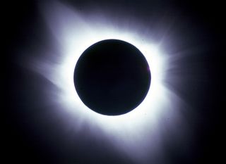 During totality, the sun's outer atmosphere, called the corona, blazes forth in all its glory. This view of the corona was captured by eclipse photographers Imelda Joson and Edwin Aguirre on July 11, 1991, along the eclipse track's central line in Baja Ca