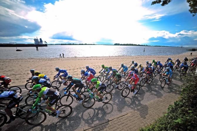 The peloton passes by a beach but no one was swimming today