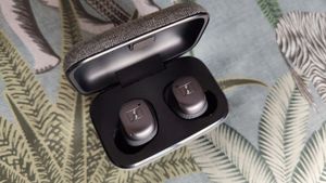Sennheiser Momentum True Wireless 3 review: woman dancing with earbuds in