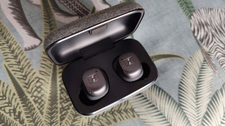 Sennheiser Momentum True Wireless 3 review: woman dancing with earbuds in