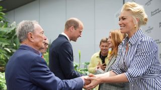 Prince William (C) stands next to US business tycoon Michael Bloomberg (L) who is shaking hands with Hannah Waddingham at an Earthshot Prize Innovation Camp in London on June 27, 2024