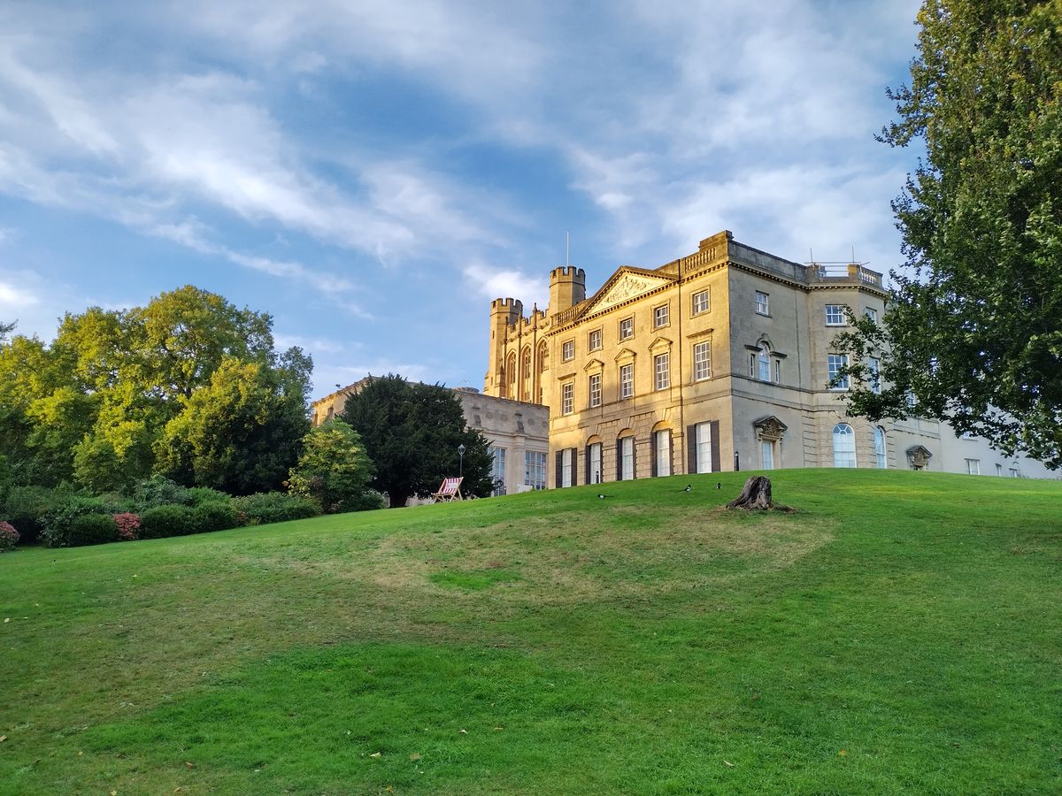 A photo of a mansion on a hill
