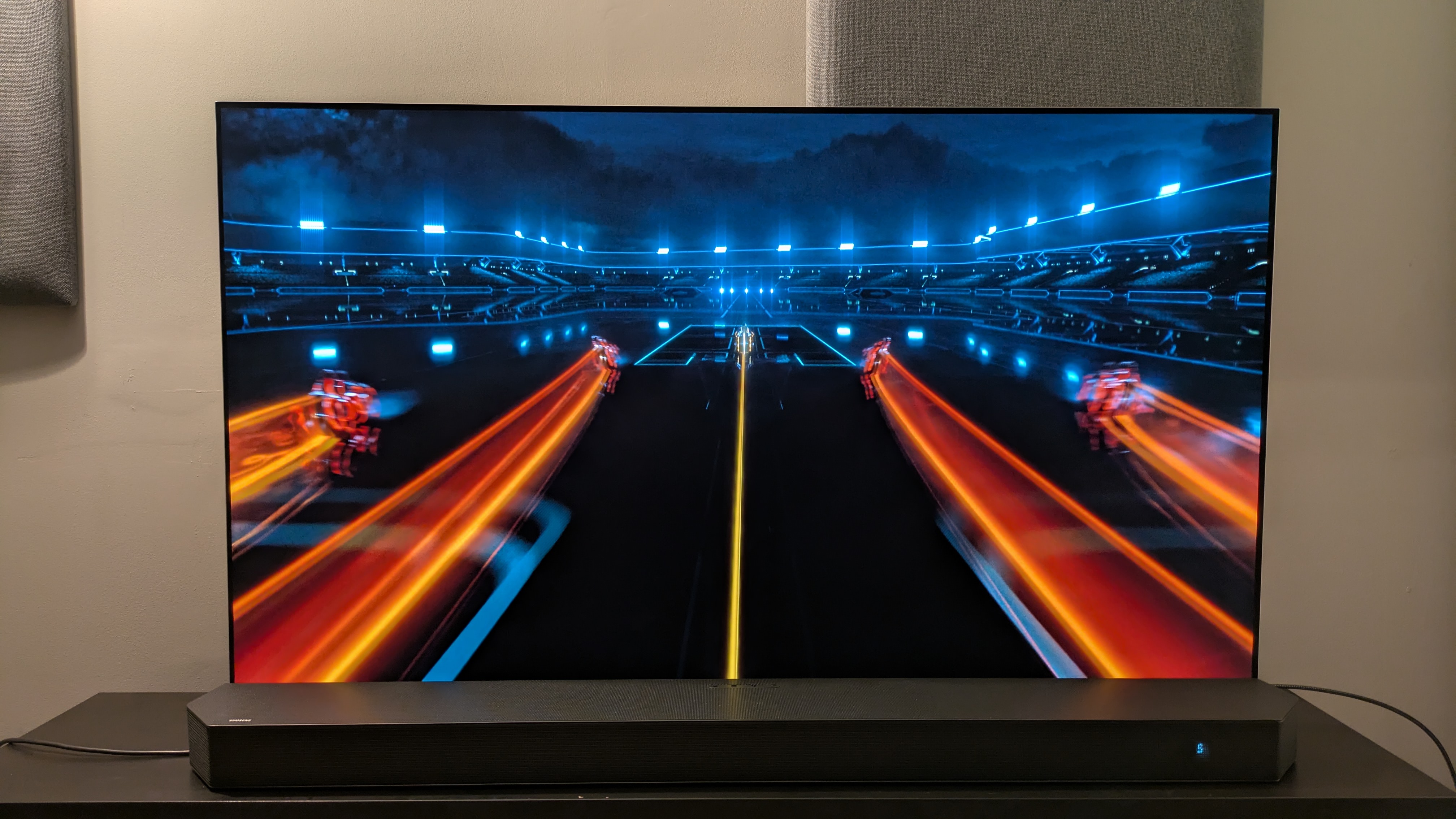 Tron: Legacy 4K Blu-ray on LG G5 showing light cycle orange trails on screen