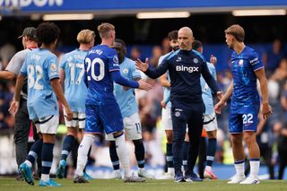 LONDON, ENGLAND - AUGUST 18: Chelsea Head Coach Enzo Maresca with Cole Palmer and Kiernan Dewsbury-Hall of Chelsea during the Premier League match between Chelsea FC and Manchester City FC at Stamford Bridge on August 18, 2024 in London, England. (Photo by Marc Atkins/Getty Images)