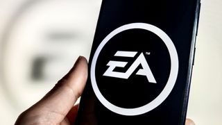 Someone holding a phone showing the EA logo.