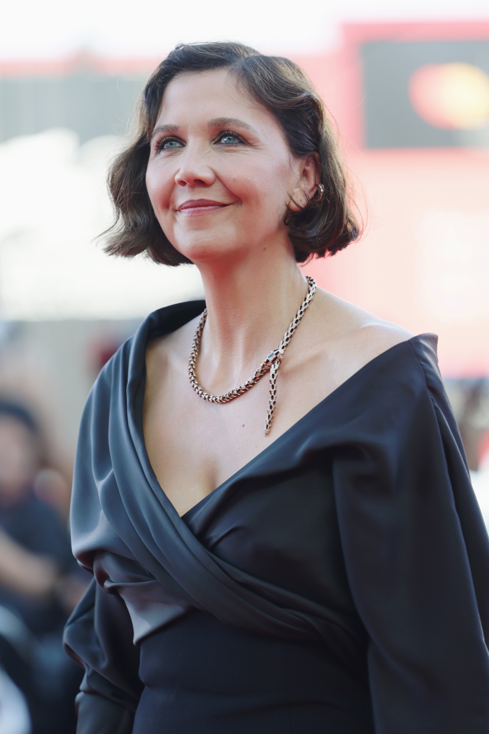 a white woman with a dark brown bob in a black gown