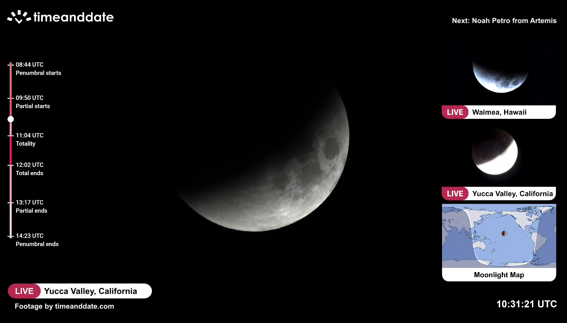 close up view of the moon with a dark patch appearing in upper left corner