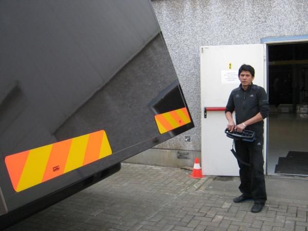 Rajen opens up the rear of the truck