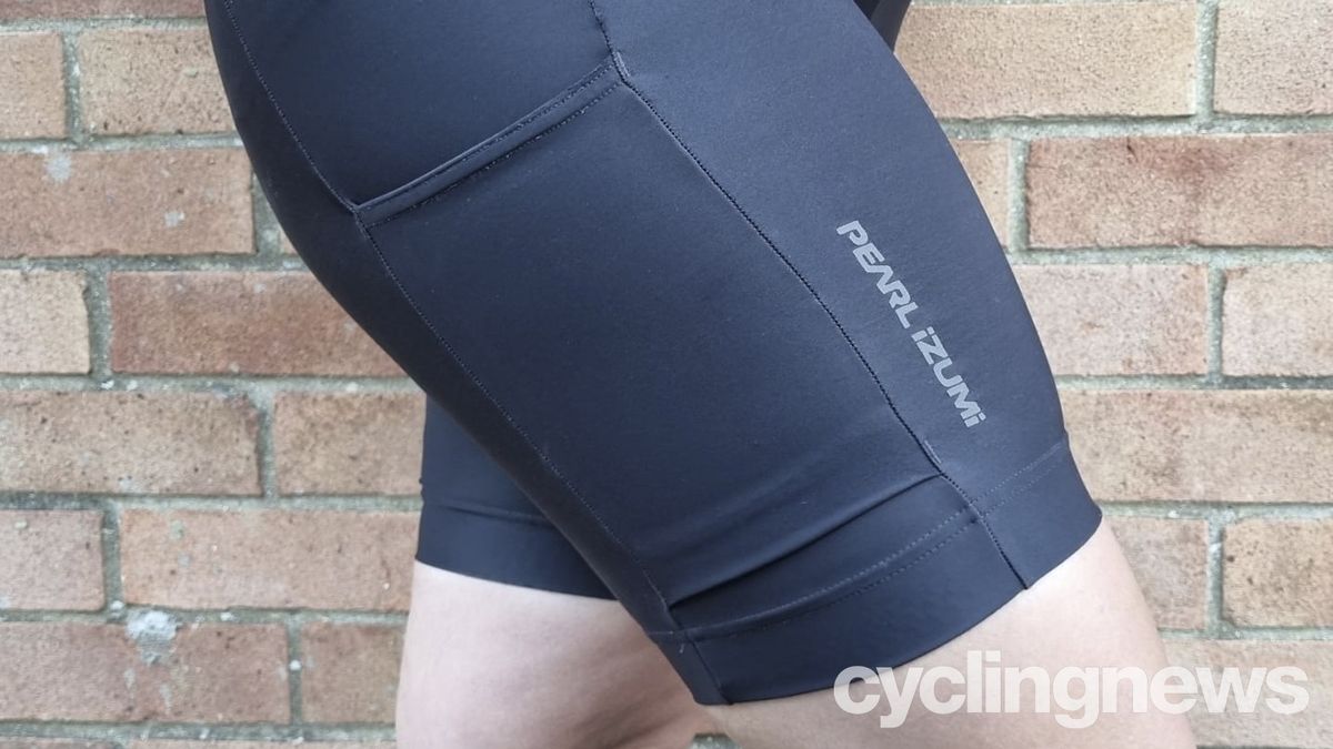 Close up of the right leg cargo pocket and reflective detailing on the Pearl Izumi Women's Expedition Shorts