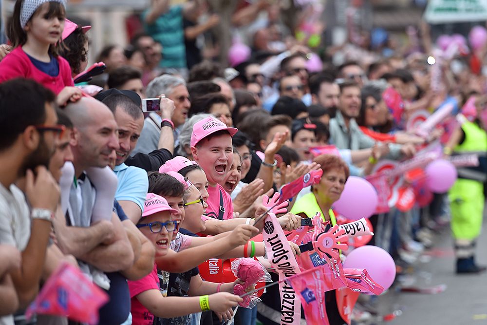 The tifosi cheer on the peloton