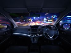 Modern black car dashboard interior with moving motion blur street background, luxury car interior concept .