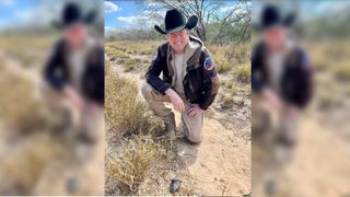 Meteorite hunter Robert Ward poses next to the chunk of the fireball he found near El Sauz
