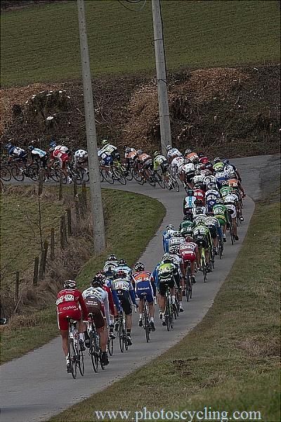 The peloton speeds through Flanders