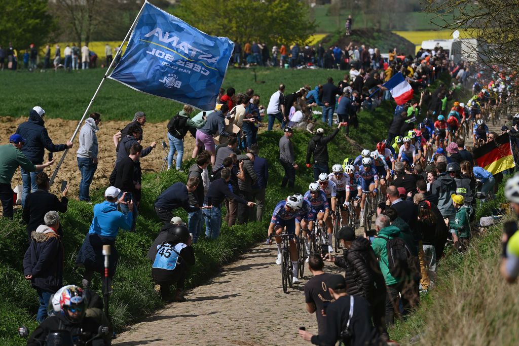 ROUBAIX FRANCE APRIL 07 Mathieu van der Poel of The Netherlands and Team Alpecin Deceuninck with teammates lead the peloton passing through the Viesly Quivy cobblestones sector during the 121st ParisRoubaix 2024 a 2597km one day race from Compiegne to Roubaix UCIWT on April 07 2024 in Roubaix France Photo by Dario BelingheriGetty Images