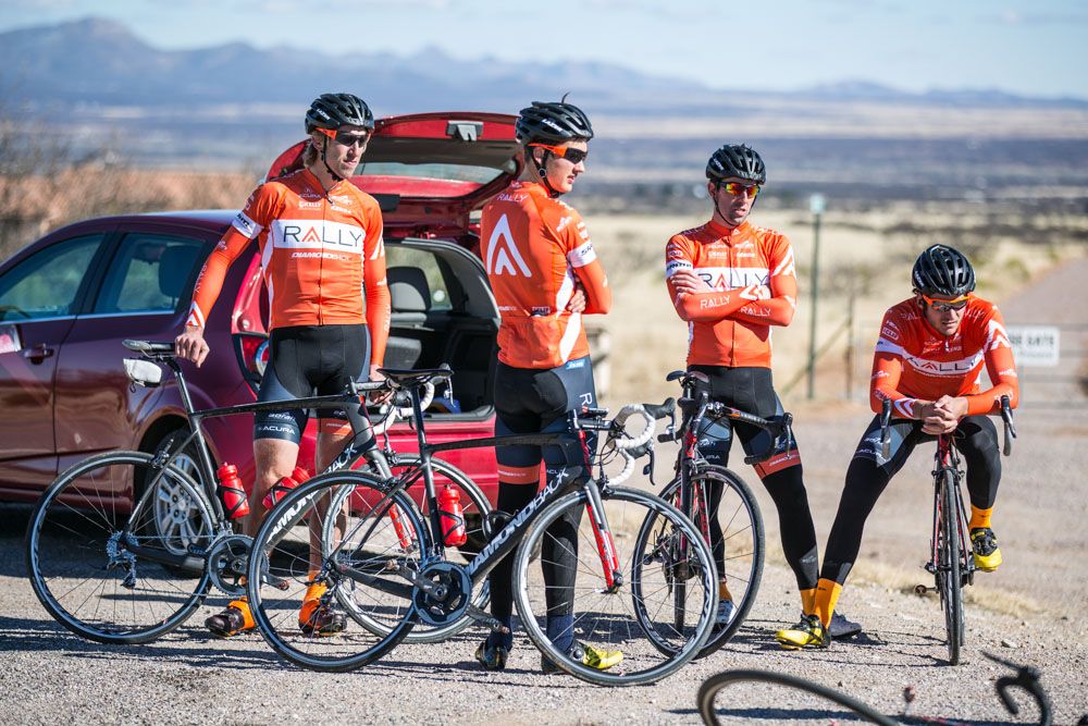 Rally Cycling riders wait for a ride at the recent training camp.