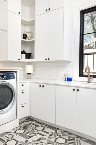 small laundry room ideas white room with corner shelves by Maestri Studio
