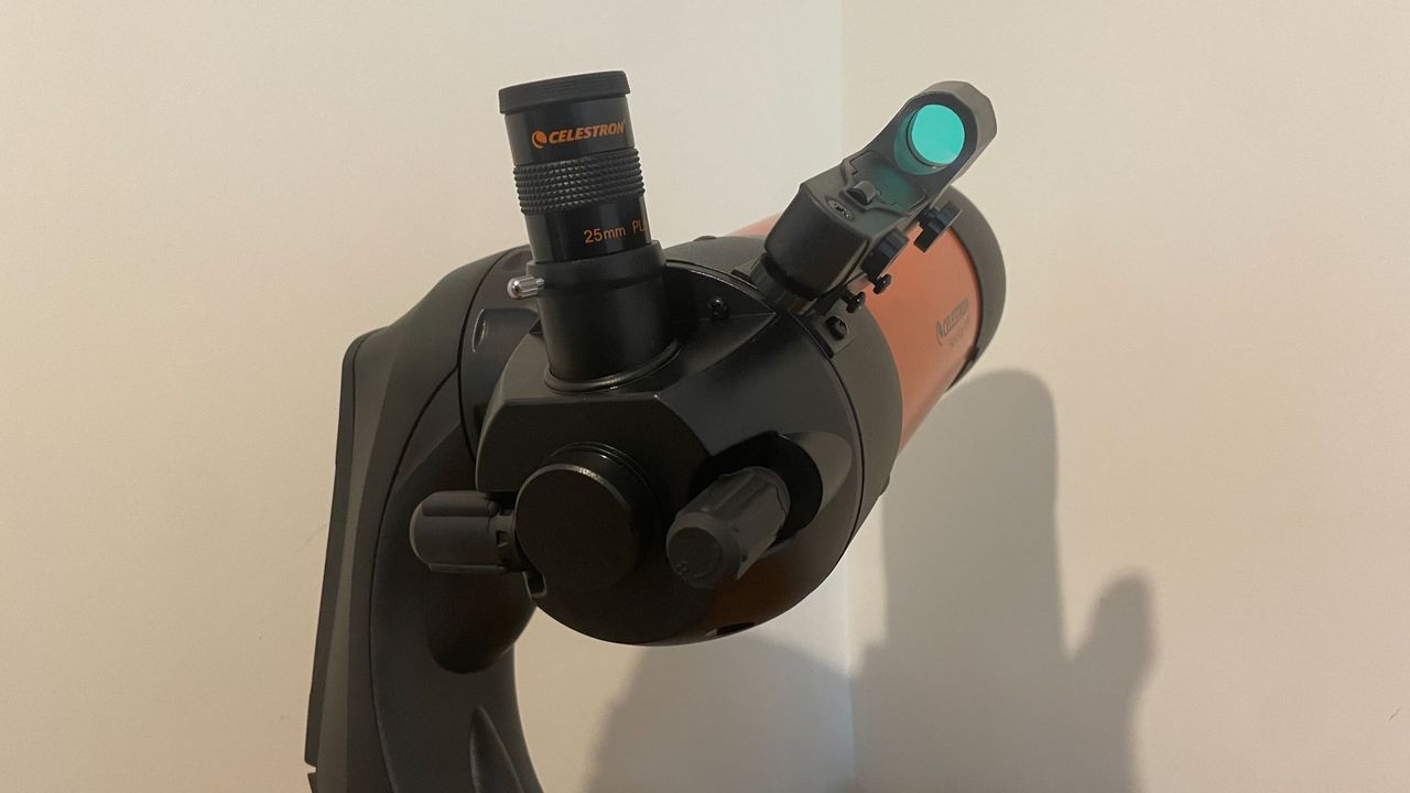 A close up of the eyepiece on a wooden table