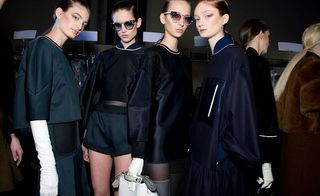 Female models dressed in the Fendi A/W 2014 backstage of the fashion show