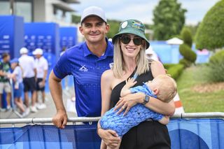 Christiaan Bezuidenhout and his wife and son at the 2024 Olympics