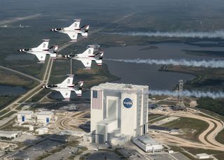 President Donald Trump wants a new Space Force branch of the U.S. military, but it reopens an old argument about military uses in space. Here, the U.S. Air Force Thunderbirds fly over NASA's Kennedy Space Center in Florida with retired NASA astronaut and 