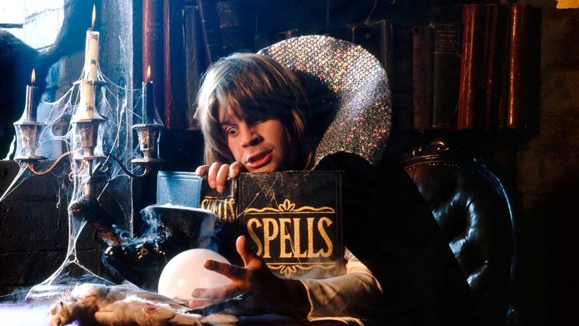 Ozzy Osbourne sitting at a table reading a book of spells during the cover shoot for Diary Of A Madman