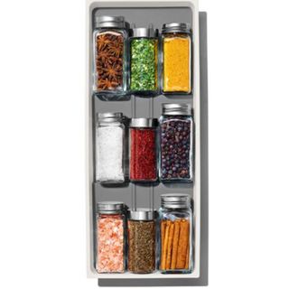 cutout of a drawer spice jar organiser filled with jars
