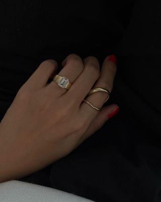 Woman wearing engagement ring.