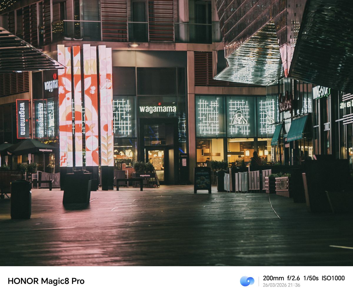 Night street scene outside restaurants, shot on the Honor Magic8 Pro at 200mm