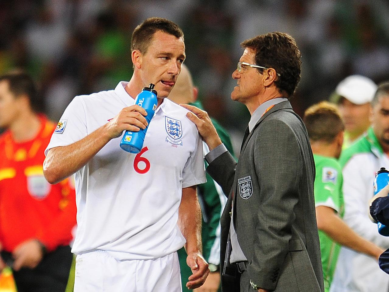 England manager Fabio Capello (left) speaks to John Terry