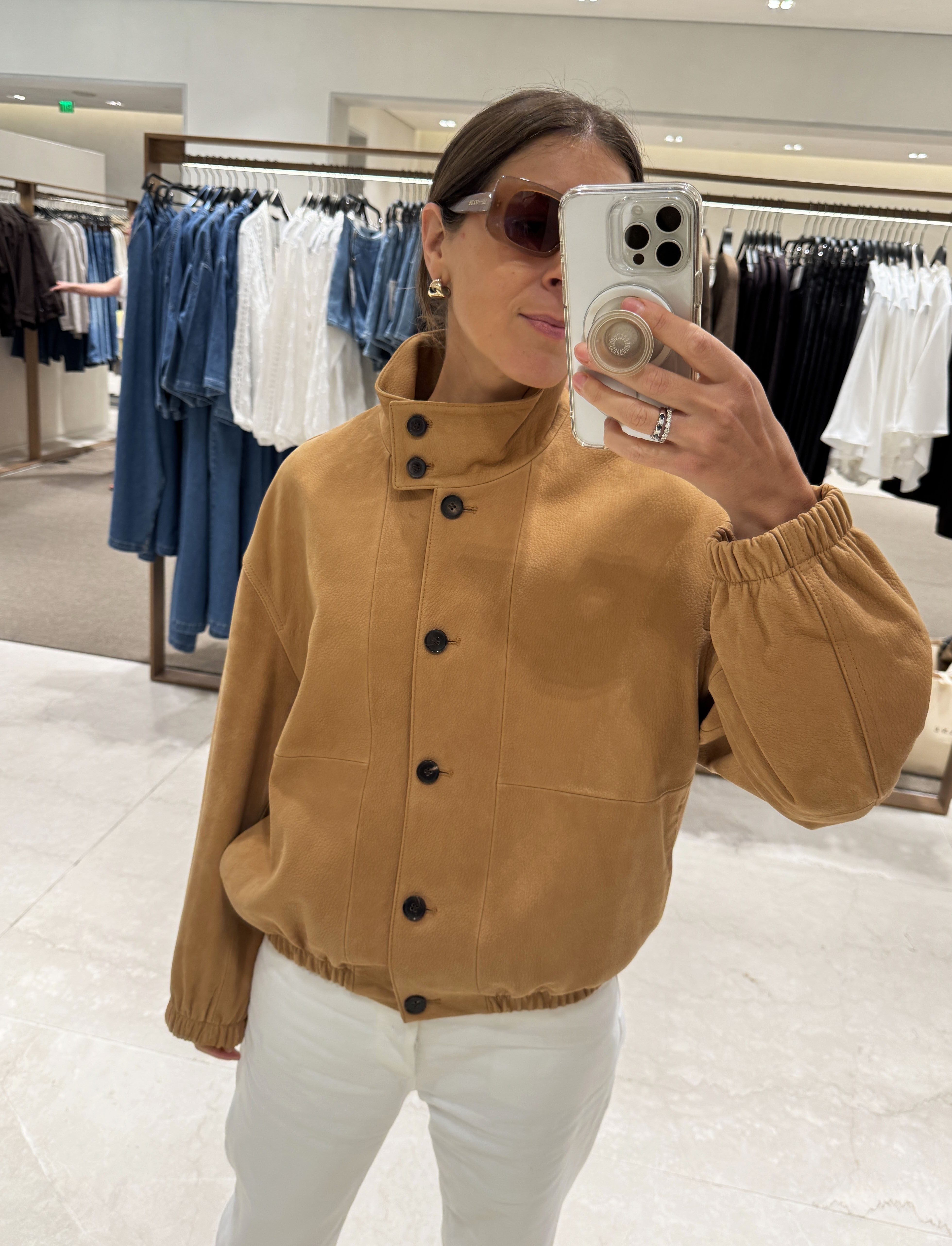 Judith Jones wearing camel funnel neck jacket