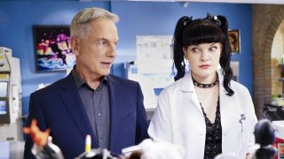 Mark Harmon standing next to Pauley Perrette in NCIS