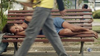 woman sleeping on bench