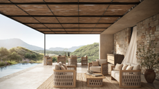 beautiful light teak seating in a covered outdoor terrace with a pool overlooking the hills
