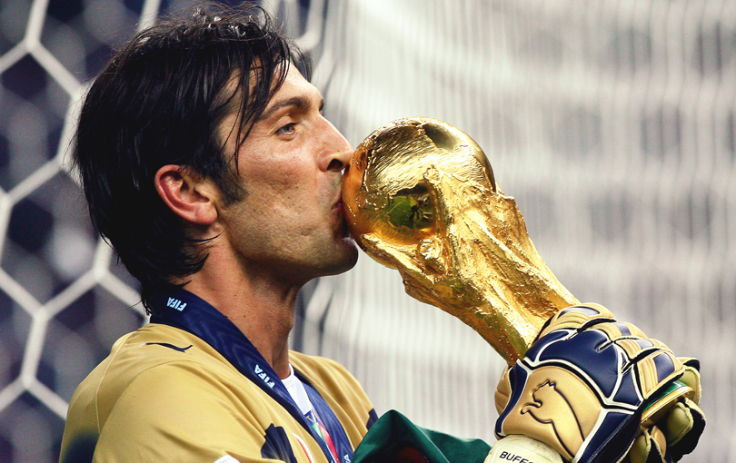 Gianluigi Buffon kisses the World Cup trophy after Italy's win over France in 2006.