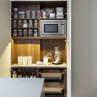 shelves with coffee machine and microwave