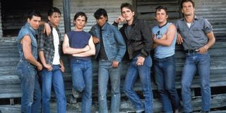 Ralph Macchio alongside his cast of The Outsiders.