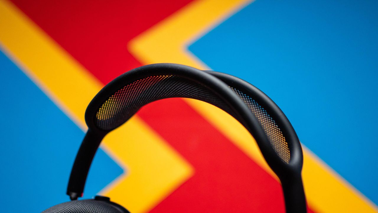 Apple AirPods Max 2 headset against a textured sheet showcasing the design