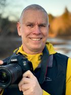 Matt Mattus holding a camera