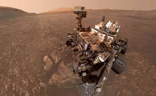 NASA&#039;s Curiosity rover, pictured here in a May 12 composite selfie, won&#039;t move as Earth and Mars reach opposite sides of the sun.