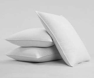Brooklinen Down Pillow against a gray background.