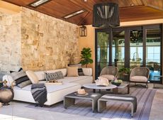 An outdoor living room with garden furniture
