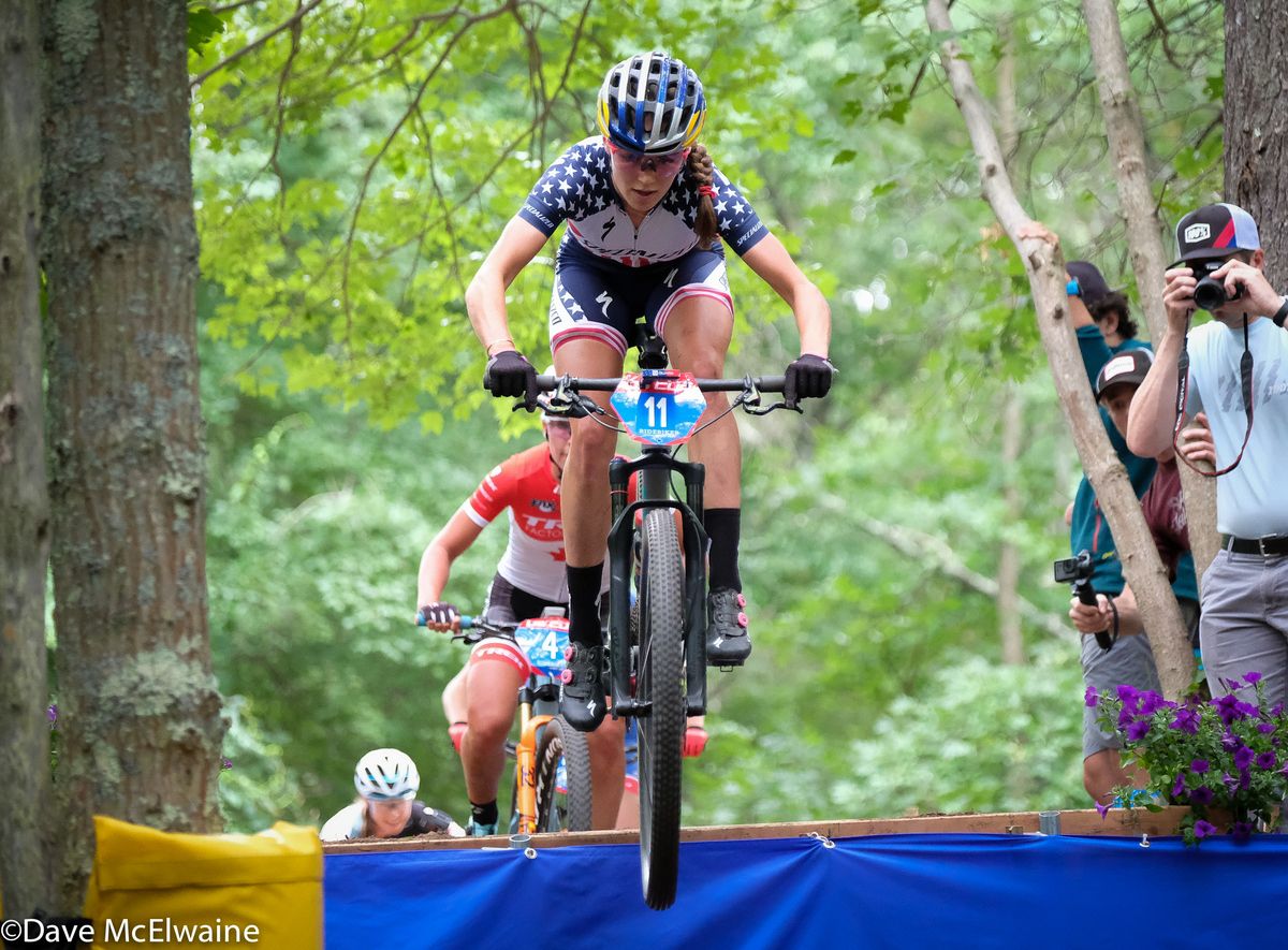 Kate Courtney (Specialized) flying off the Shimano jump