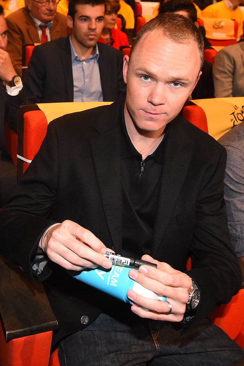 Chris Froome signs a few autographs