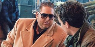 Jonah Hill in a jacket and sunglasses in War Dogs