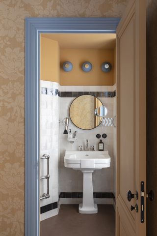 A bathroom painted ochre and blue